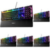Dedicated multimedia controls on a SteelSeries RGB gaming keyboard with wrist rest.