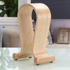 Wooden bookend on a glass surface with a blurred indoor background