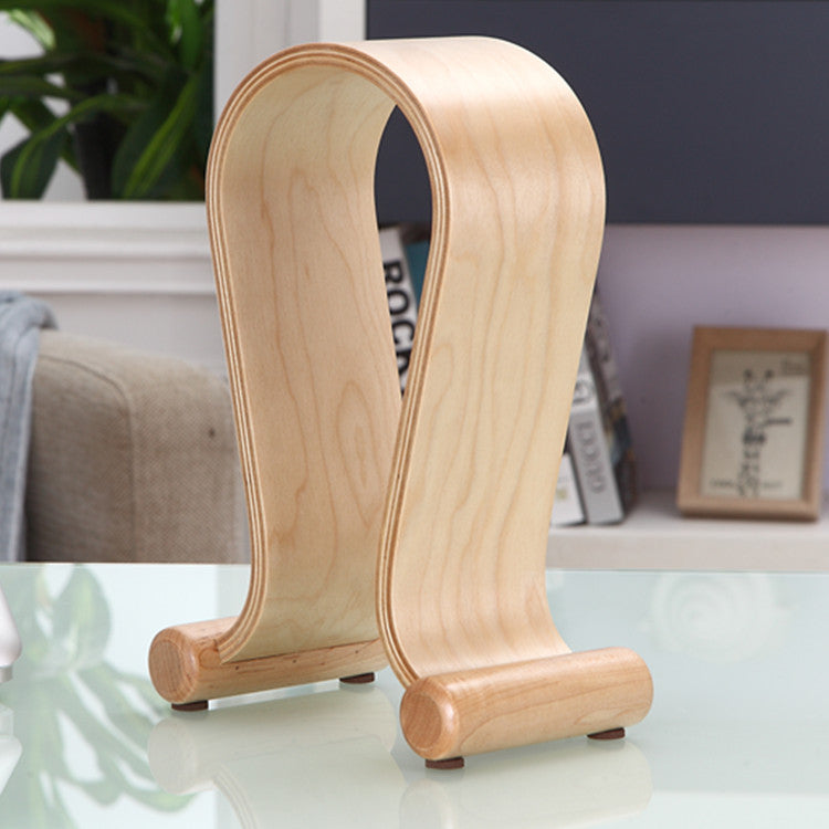 Wooden bookend on a glass surface with a blurred indoor background