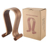 Wooden headset earphone stand with cardboard box on a white background
